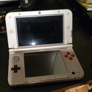 Nintendo Silver and Red Handheld Console